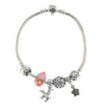A charm bracelet and five charms,