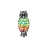 A plique-a-jour enamel owl brooch, with ruby eyes and pyrite detail.May be worn as a pendant.