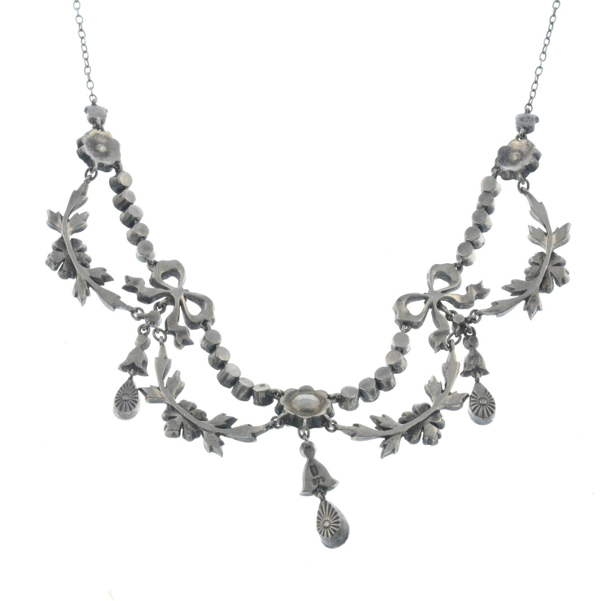 An early 20th century floral paste necklace with bow detail.Stamped 925. - Image 2 of 2