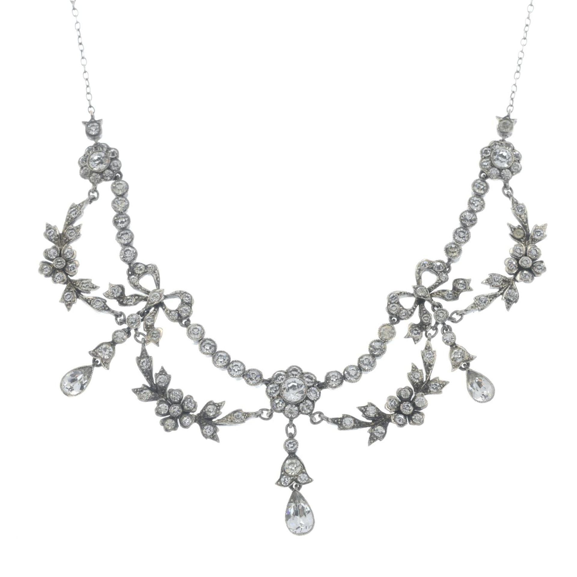An early 20th century floral paste necklace with bow detail.Stamped 925.
