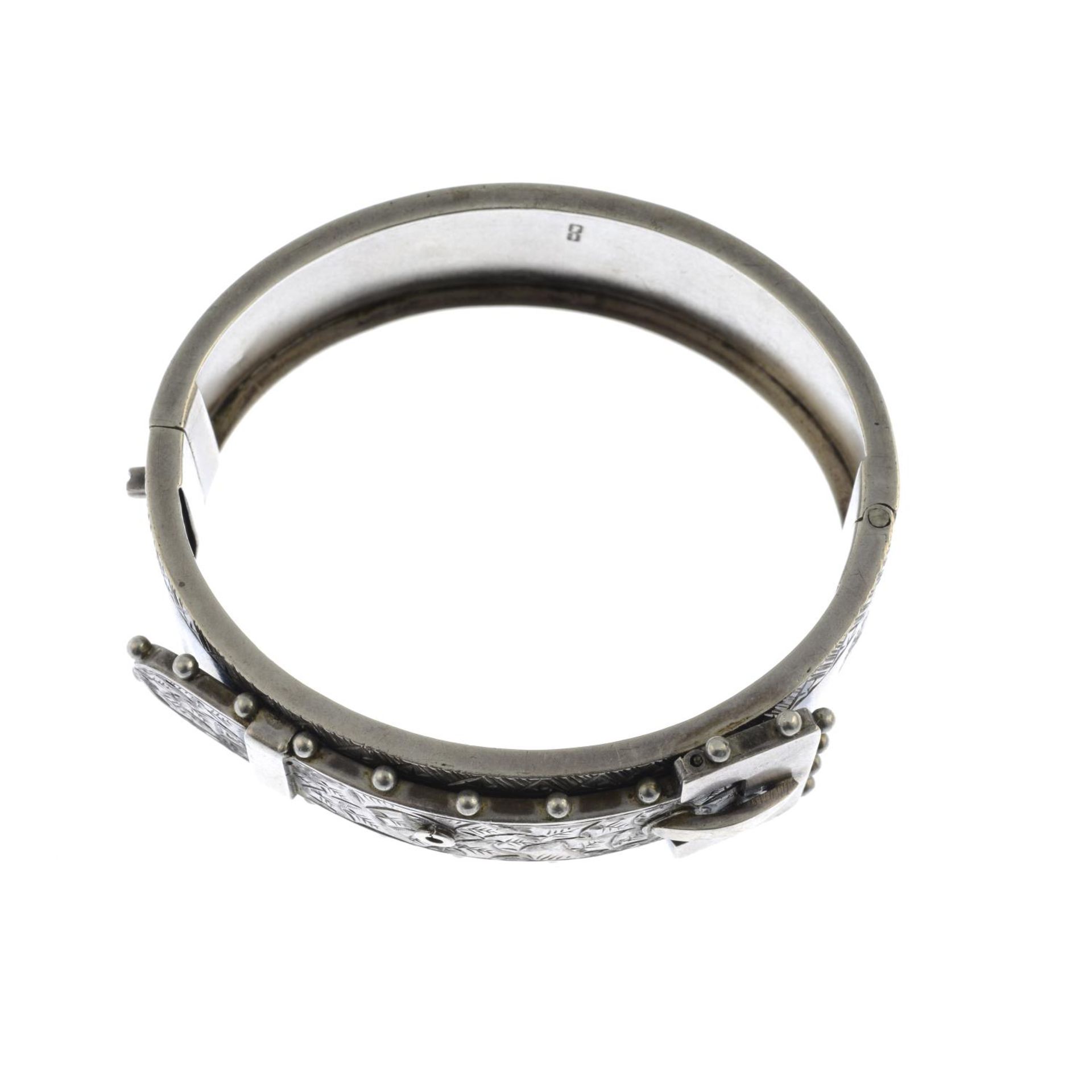 A Victorian silver buckle bangle.Hallmarks for Birmingham, 1883.Inner diameter 5.8cms. - Image 2 of 2