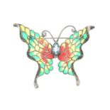 A plique-a-jour enamel butterfly brooch, with blue topaz highlight and pyrite accent.Stamped 925.