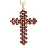 A silver garnet cross pendant, with chain.Stamped 925.Length of cross 5cms.