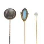 Three gem-set stickpins.A Mabe pearl stickpin, length 7cms, 3.20gms.