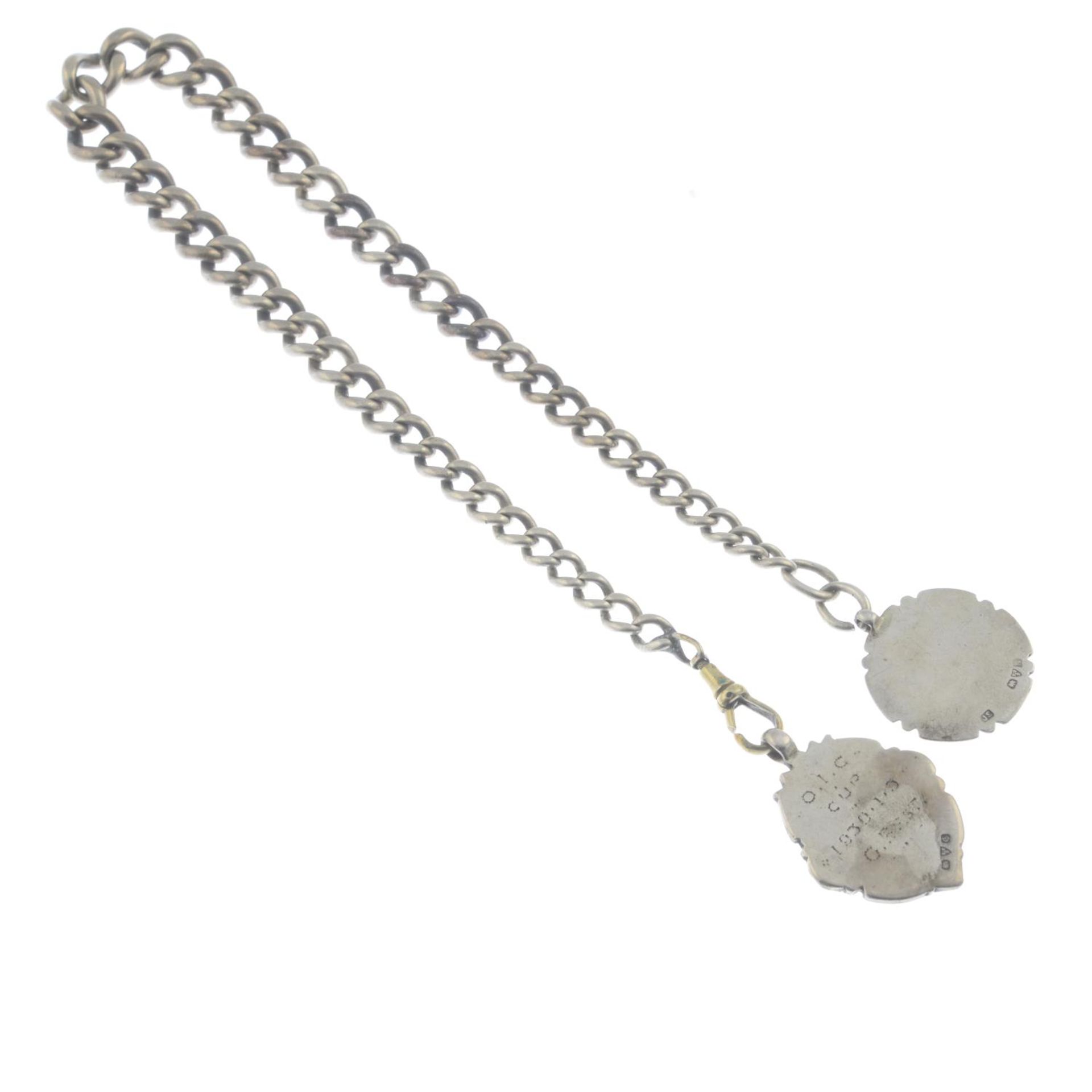 A Victorian silver albert chain and two fobs. - Bild 2 aus 2