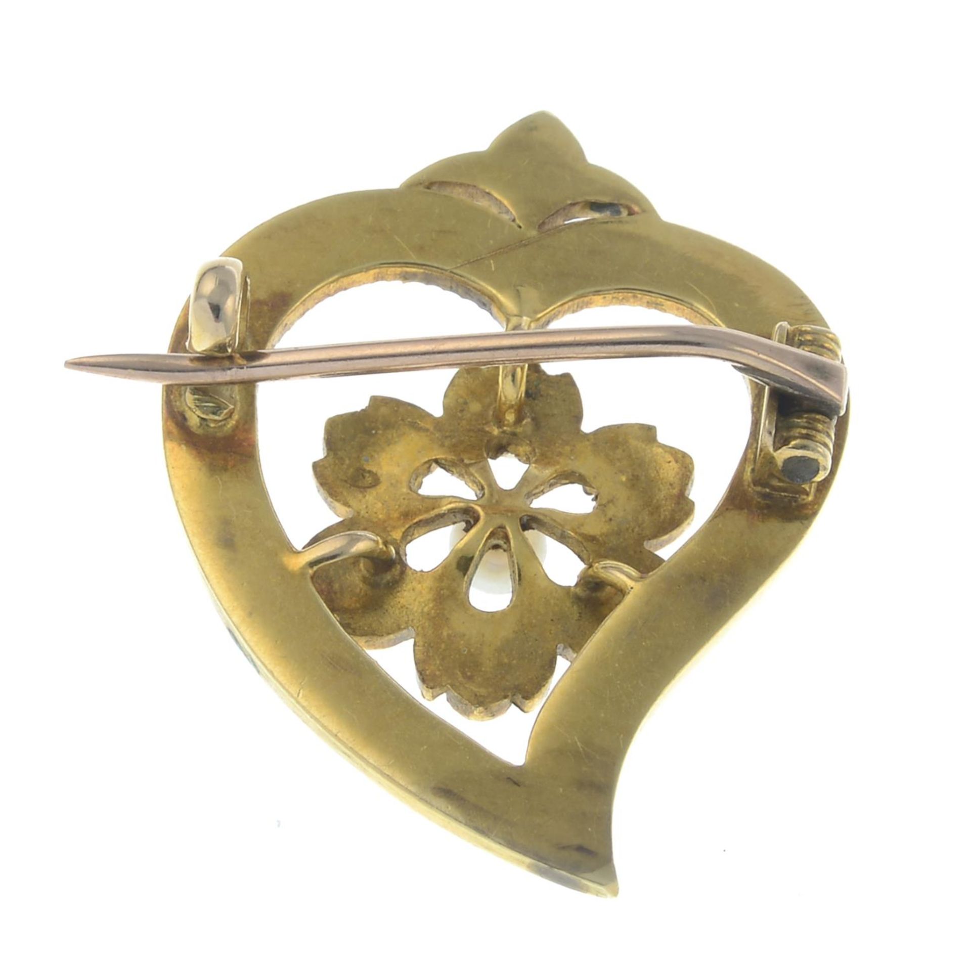 An early 20th century cultured and split pearl and enamel openwork heart brooch.Length 2.7cms. - Image 2 of 2
