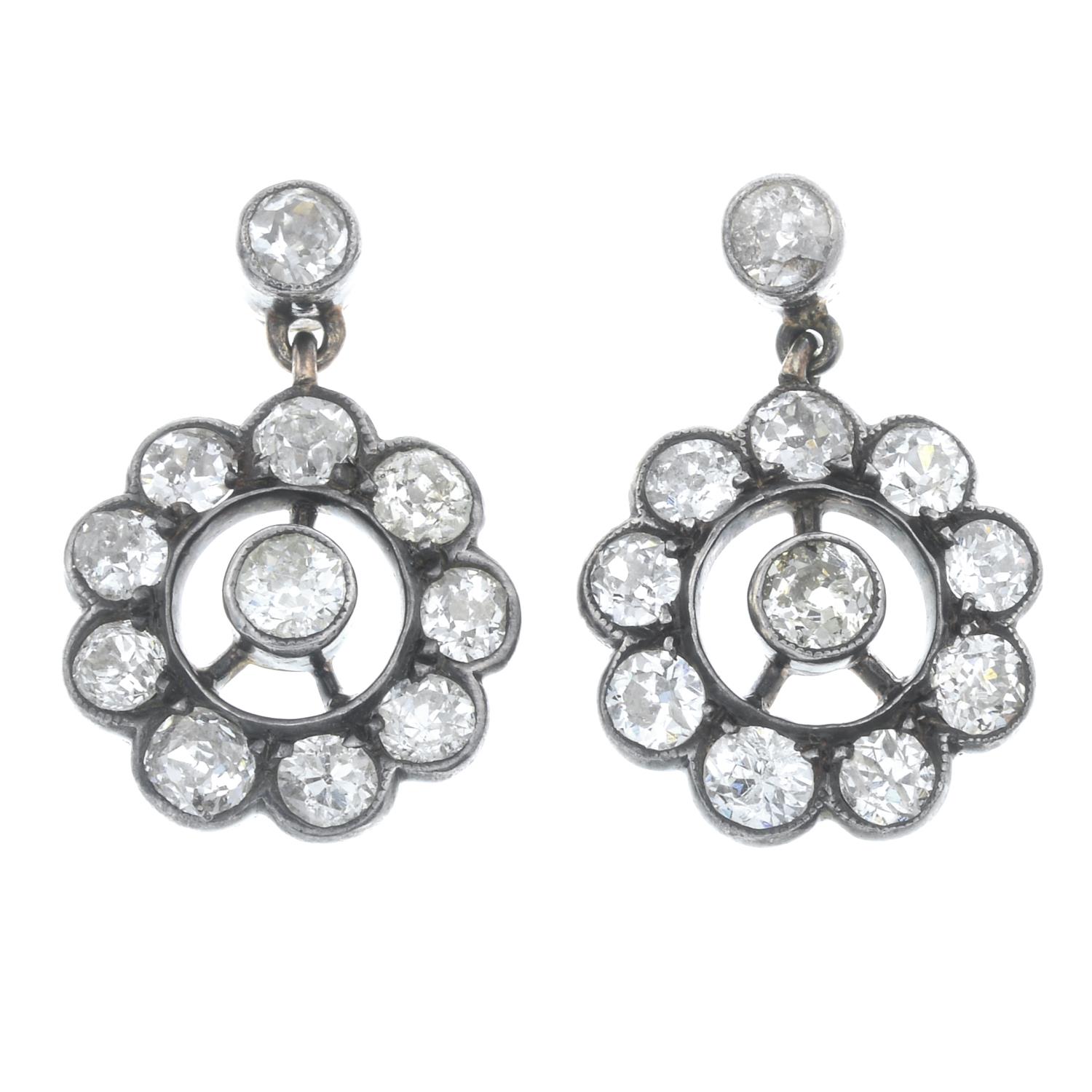 A pair of diamond cluster earrings.Estimated total diamond weight 2cts,