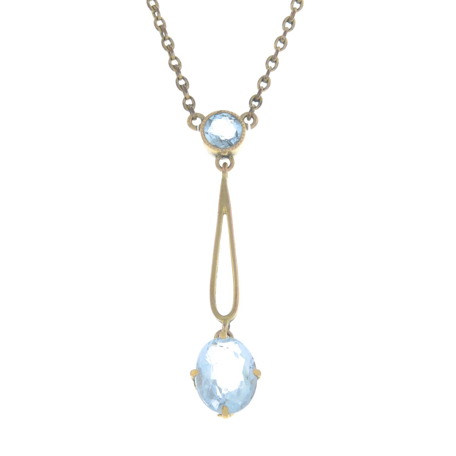 An early 20th century 9ct gold aquamarine pendant, on a 9ct gold integral chain.Stamped 9CT.