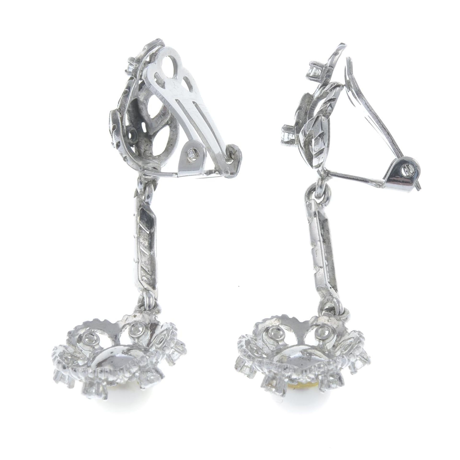 A pair of diamond and cultured pearl drop earrings.Estimated total diamond weight 0.55ct. - Image 2 of 2