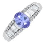 An 18ct gold tanzanite and diamond dress ring.Tanzanite with report 1/13395-005,