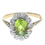 A peridot and single-cut diamond cluster ring.Estimated total diamond weight 0.20ct.Stamped