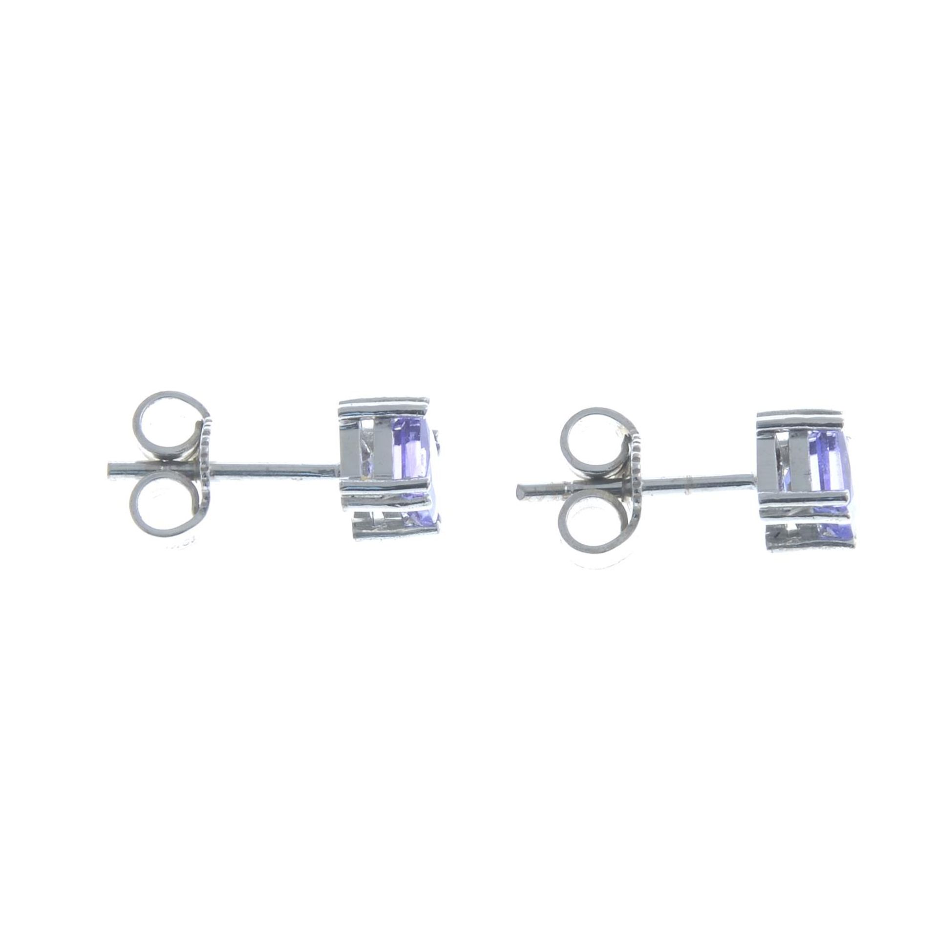 A pair of tanzanite stud earrings.Butterfly backs stamped 18Kt. - Image 2 of 2