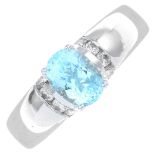 An 18ct gold aquamarine and diamond dress ring.Estimated total diamond weight 0.10ct.