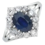 An 18ct gold sapphire and brilliant-cut diamond cluster ring.Total diamond weight 0.75ct,