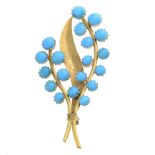 A turquoise foliate brooch.Stamped 750.Length 6cms.