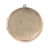 An early 20th century 9ct gold front and back foliate engraved locket.Stamped 9ct Front and