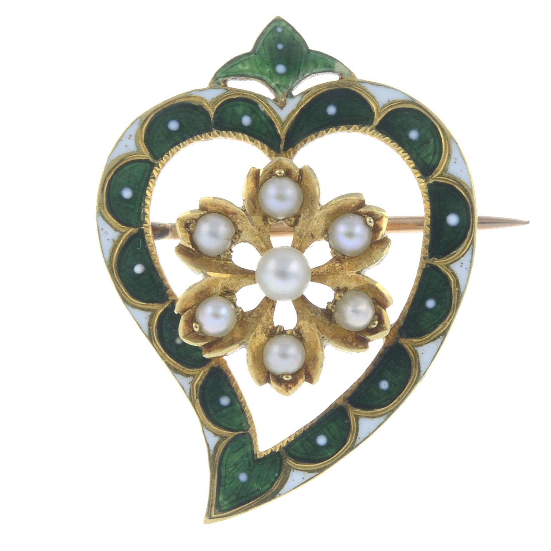 An early 20th century cultured and split pearl and enamel openwork heart brooch.Length 2.7cms.