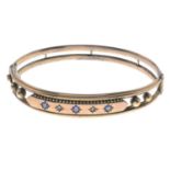 A late 19th century 9ct gold sapphire and diamond bangle.Stamped 9C.