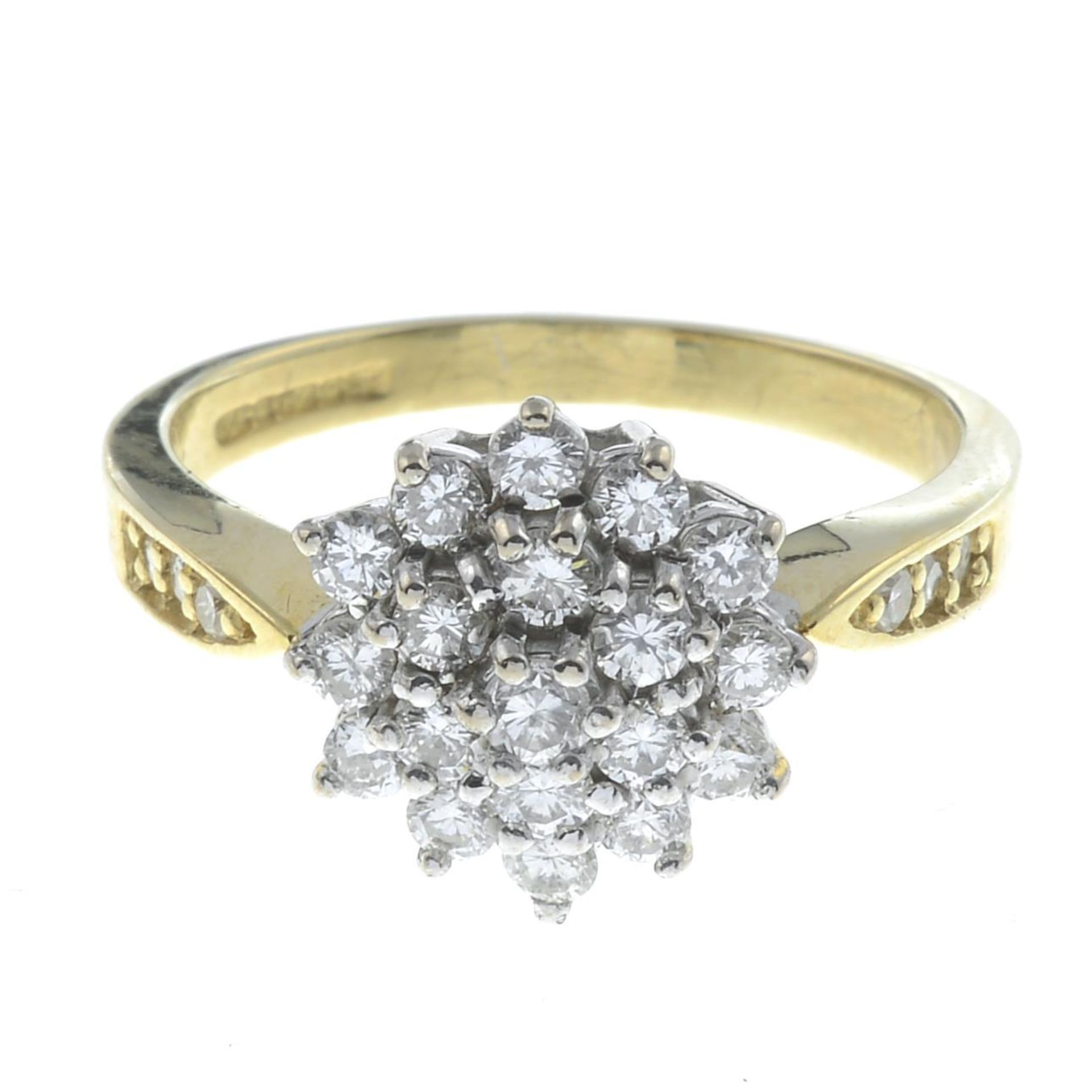 An 18ct gold diamond cluster ring.Estimated total diamond weight 0.65ct.