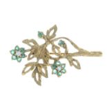 A 1970s 9ct gold emerald and diamond floral spray brooch.Hallmarks for 9ct gold.