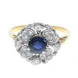 A sapphire and diamond cluster ring.Estimated total diamond weight 0.30ct.Ring size J1/2.