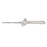 An early 20th century diamond bar brooch.Estimated total diamond weight 0.60ct,