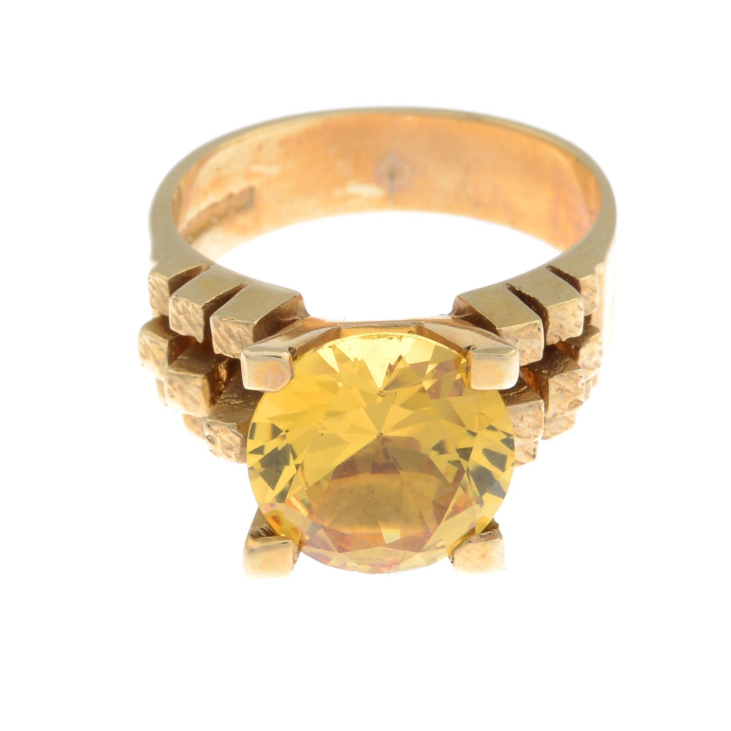 A 9ct gold yellow cubic zirconia single-stone ring.Hallmarks for Birmingham, 1994.Ring size M.