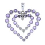 An amethyst and diamond heart-shape pendant.Stamped 14K.