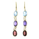 A pair of blue topaz, amethyst and garnet drop earrings.Length 4.4cms.