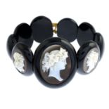 A late Victorian jet and shell cameo bracelet.Length 18cms.