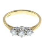 An 18ct gold brilliant-cut diamond three-stone ring.Estimated total diamond weight 0.55ct,