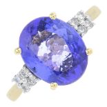 An 14ct gold tanzanite and diamond dress ring.Tanzanite calculated weight 2.71cts,