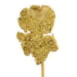 A gold 'nugget' stickpin.