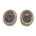 Two pairs of 9ct gold emerald and garnet earrings,