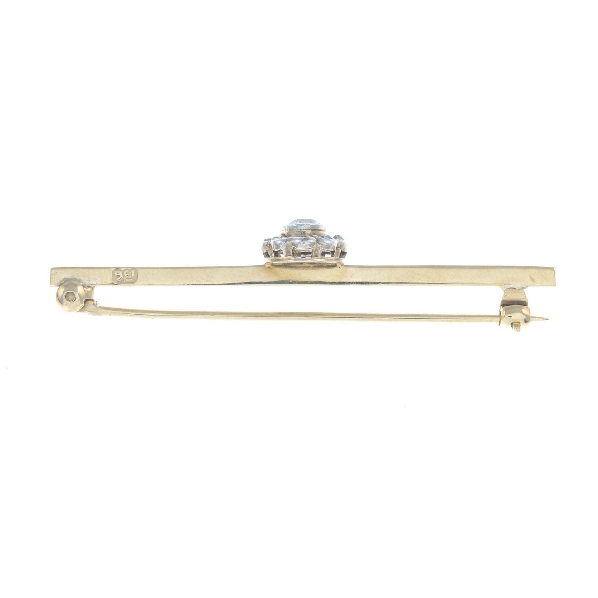 An early 20th century 9ct gold diamond bar brooch.Estimated total diamond weight 0.40ct, - Bild 2 aus 2