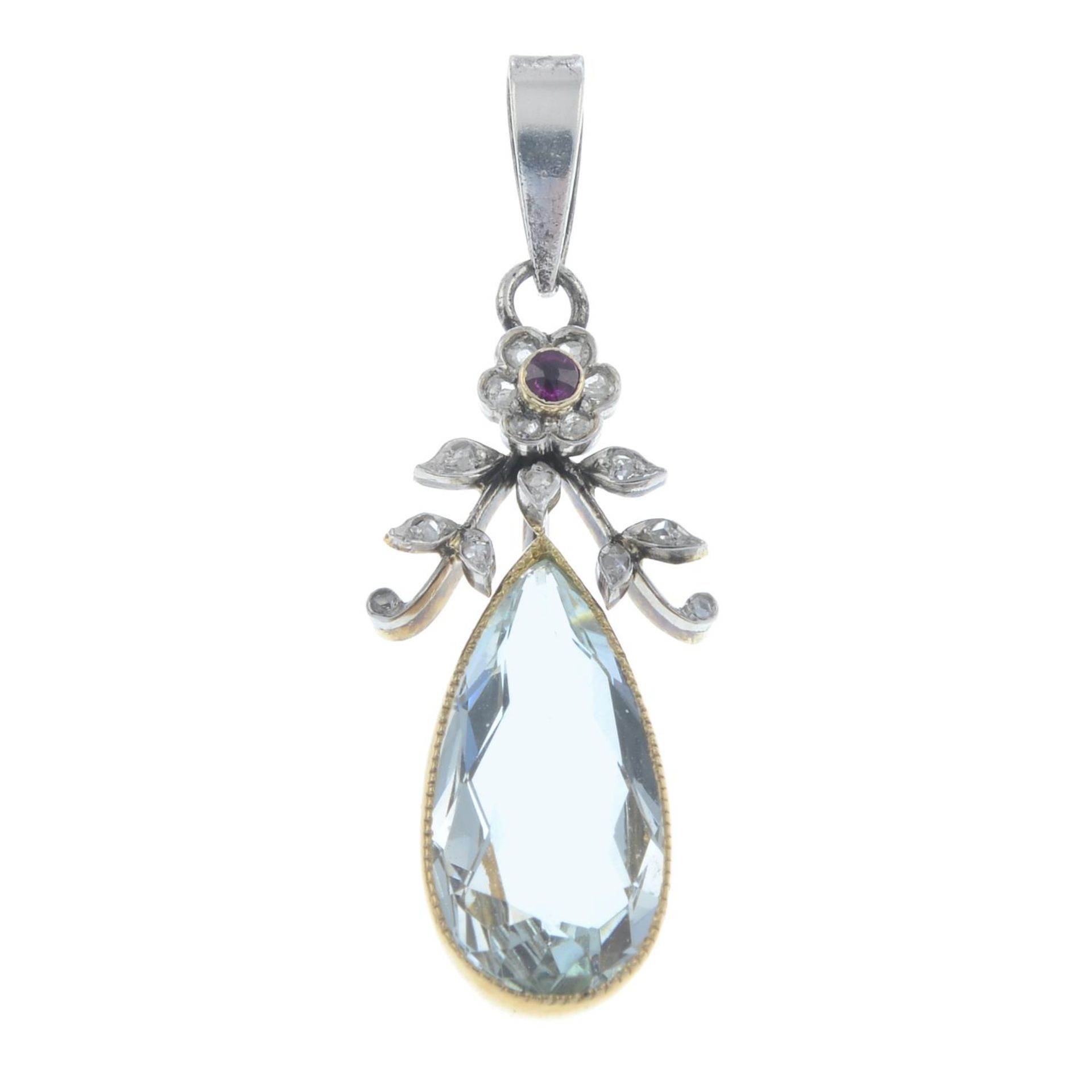 An early 20th century gold and platinum, aquamarine, ruby and diamond floral pendant.