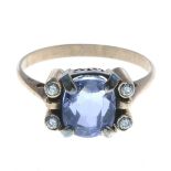 A sapphire and white sapphire dress ring.Principal sapphire calculated weight 3.25cts,