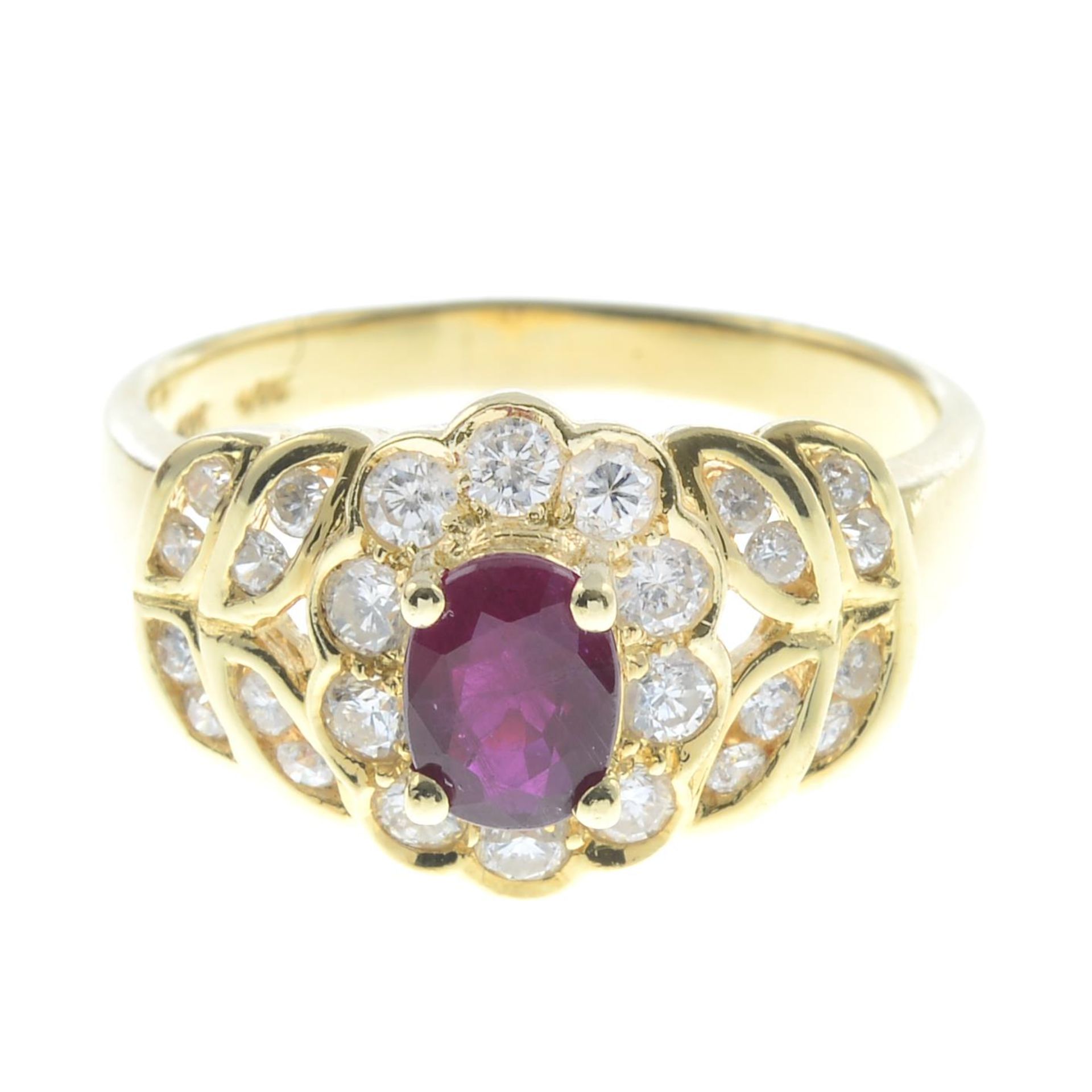 A ruby and diamond floral cluster ring.Estimated total diamond weight 0.60ct,