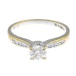 An 18ct gold diamond ring.Total diamond weight 0.58ct, stamped to band.