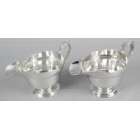 A pair of silver sauce boats,