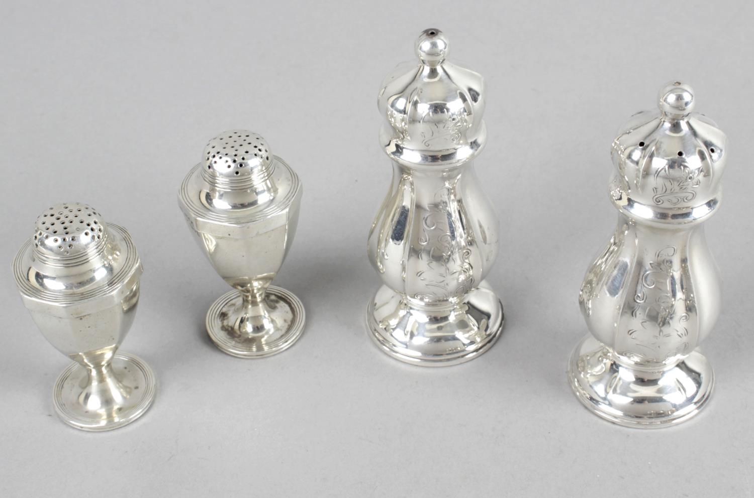 Two pairs of salts and peppers and four other condiment pieces - an urn shaped pair - London 1906