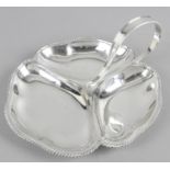 A mid-20th century silver hors d'oeuvre dish of three shaped bowls with pie crust rim below a