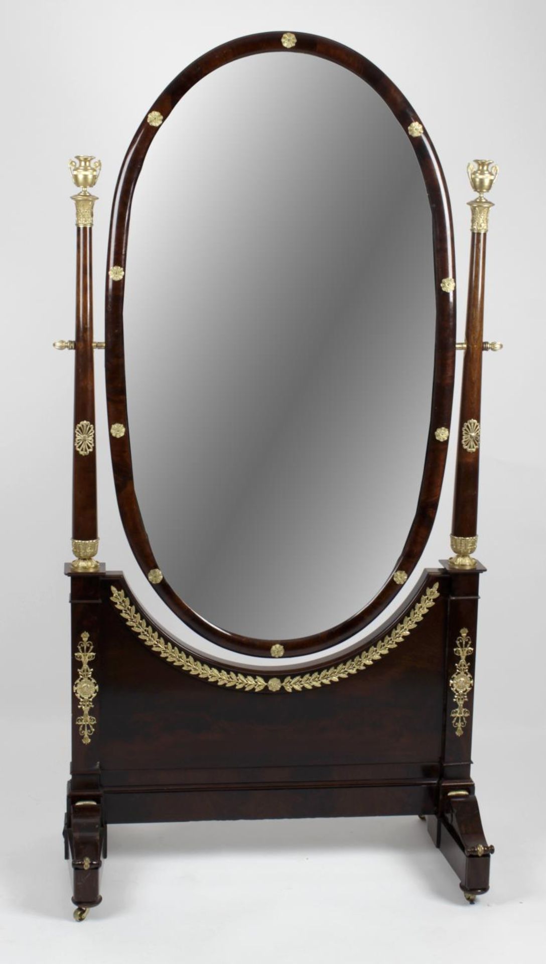 An early 20th century mahogany ormolu mounted French Empire style cheval mirror,