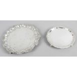 Two silver card trays - a Victorian card tray with shaped border with shell motif standing on three