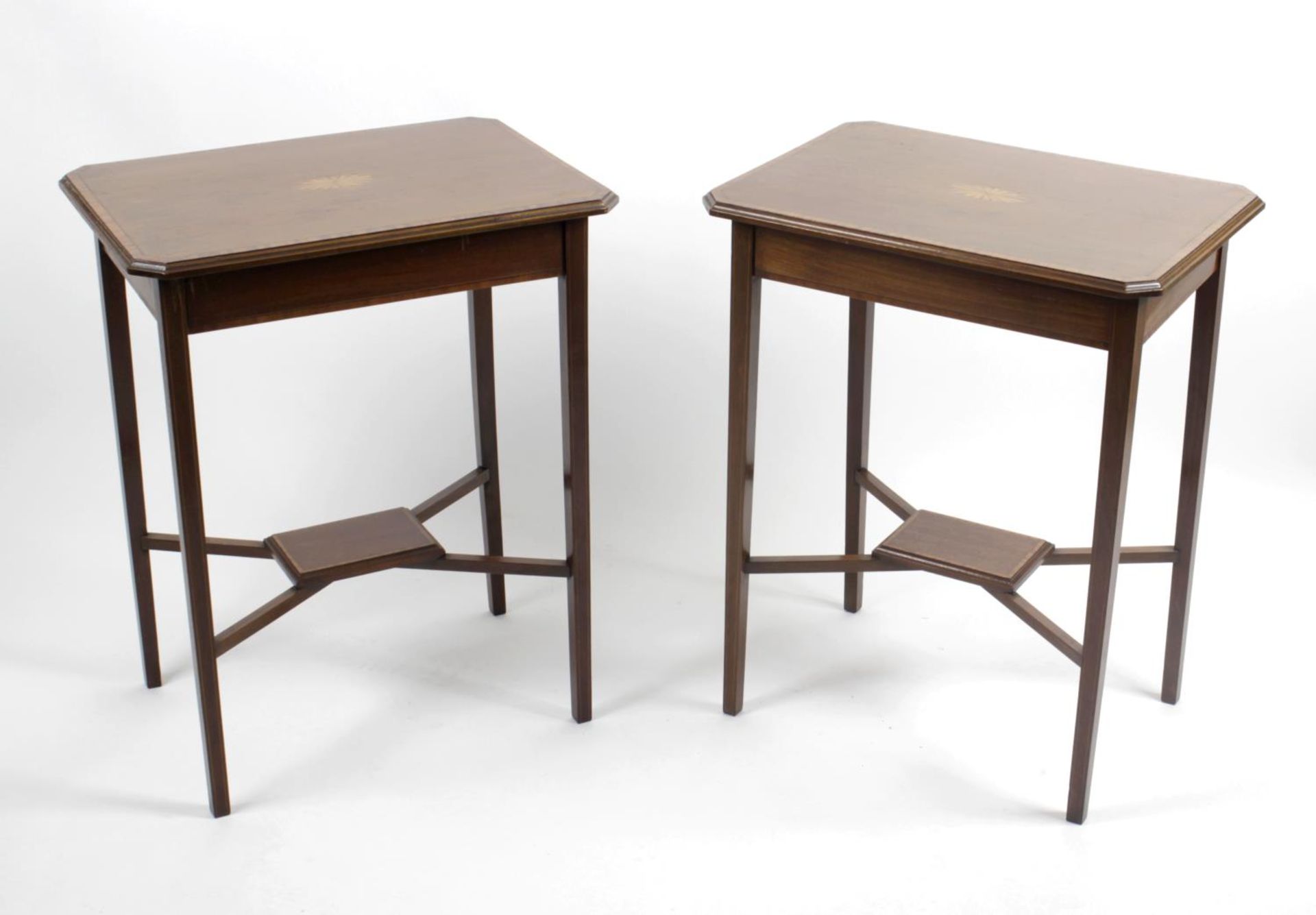 A pair of early twentieth century mahogany side tables,