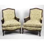 A pair of Louis XV style stained beech framed armchairs,