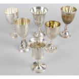 A selection of six assorted silver goblets,