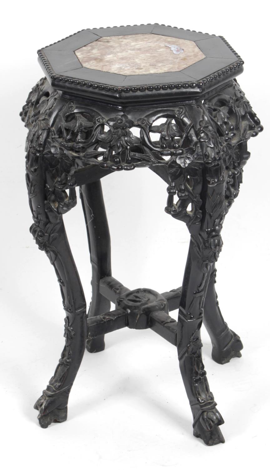 An Oriental carved hardwood stand,