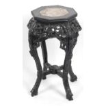 An Oriental carved hardwood stand,