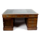 A large early twentieth century mahogany twin pedestal partners desk,